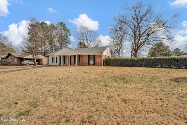 view of front of property with a front yard and a porch