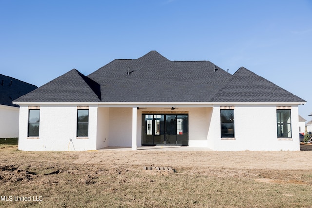 rear view of house featuring ceiling fan