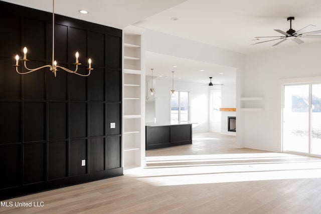 interior space featuring ceiling fan, plenty of natural light, and light hardwood / wood-style floors