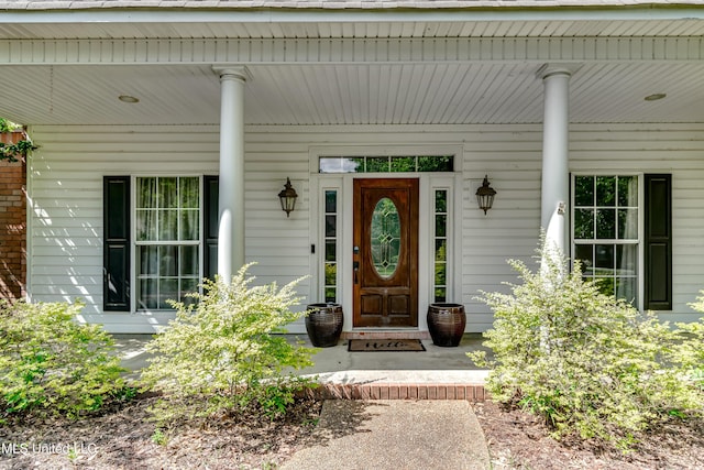 doorway to property with a porch