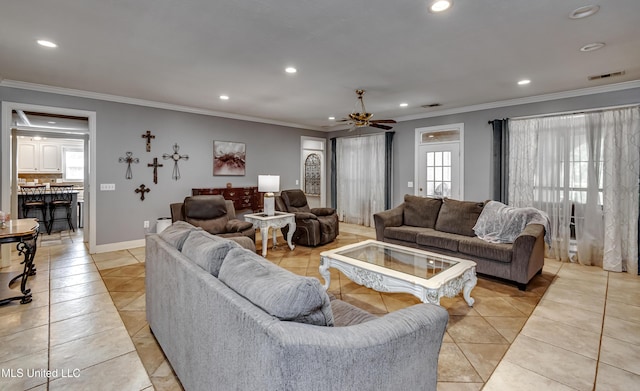 living room with light tile patterned floors, ceiling fan, recessed lighting, and crown molding