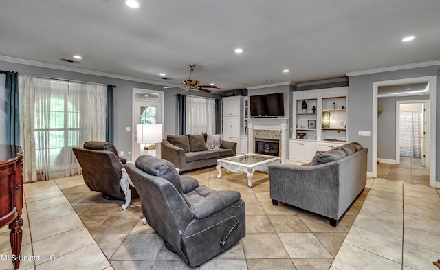 living room with crown molding, a ceiling fan, and recessed lighting