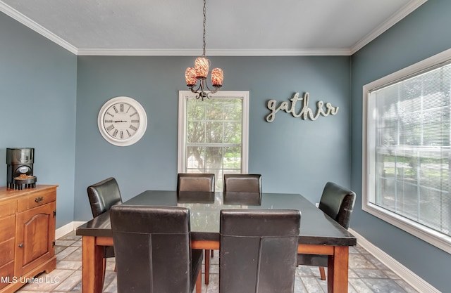 dining space featuring baseboards, an inviting chandelier, ornamental molding, and stone tile flooring