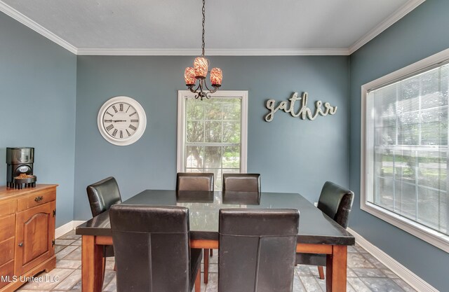 203 Remington Dr, Brandon, MS 39042 - dining space featuring baseboards, an inviting chandelier, ornamental molding, and stone tile flooring