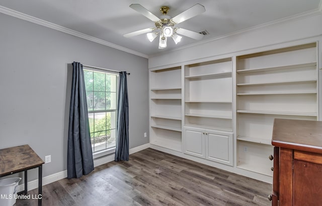 unfurnished office featuring crown molding, dark wood finished floors, ceiling fan, and baseboards