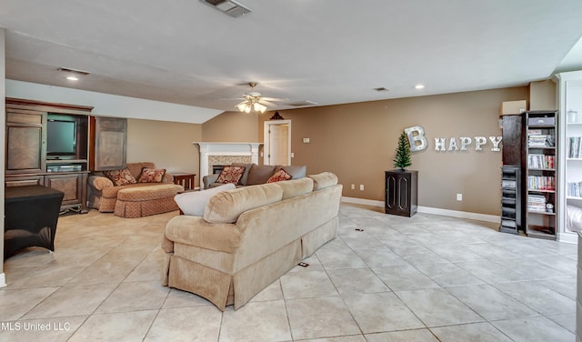 living room featuring ceiling fan, recessed lighting, baseboards, light tile patterned floors, and visible vents