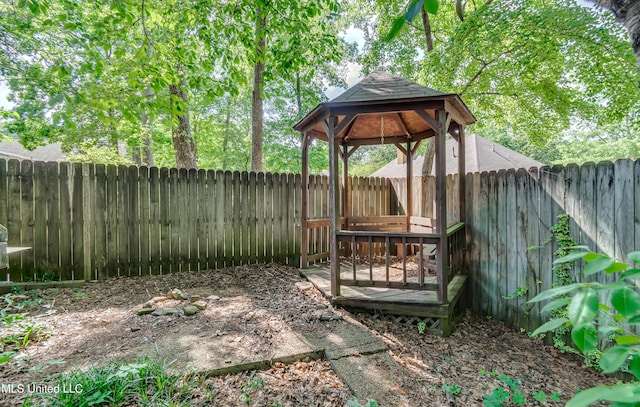 view of yard with a fenced backyard and a gazebo