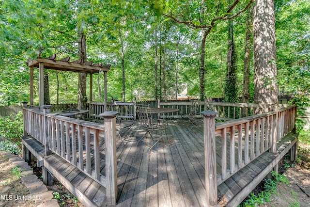 wooden deck with outdoor dining area