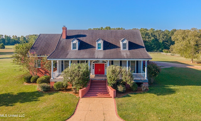 cape cod-style house featuring covered porch and a front yard