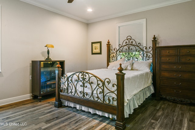 bedroom with ornamental molding and dark hardwood / wood-style flooring