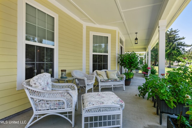 view of patio with covered porch and an outdoor living space