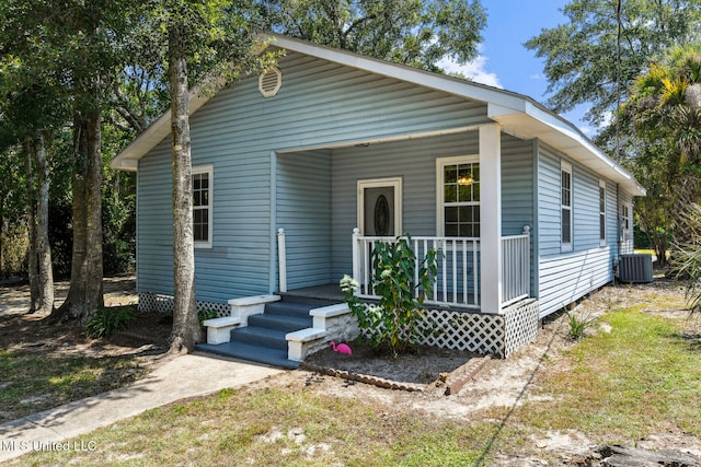 bungalow-style home with covered porch and central AC