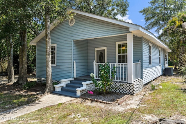 301 N Necaise Ave, Bay Saint Louis, MS 39520 - shotgun-style home featuring covered porch and cooling unit