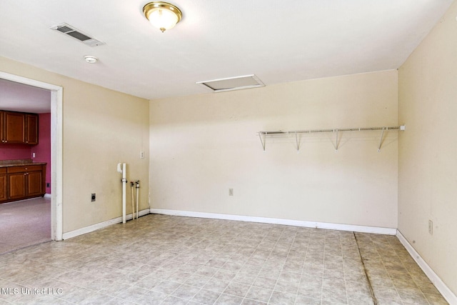 301 N Necaise Ave, Bay Saint Louis, MS 39520 - spare room with attic access, baseboards, and a smoke detector