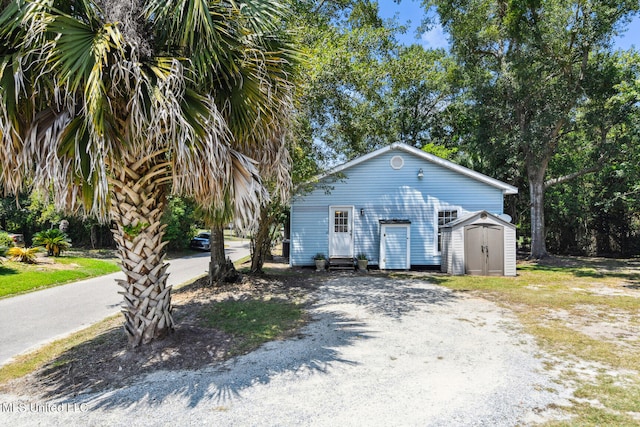 view of front facade featuring a storage shed