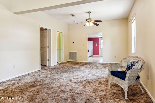 sitting room with ceiling fan and carpet floors