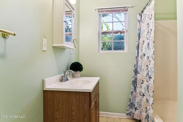 bathroom featuring vanity and shower / bath combo