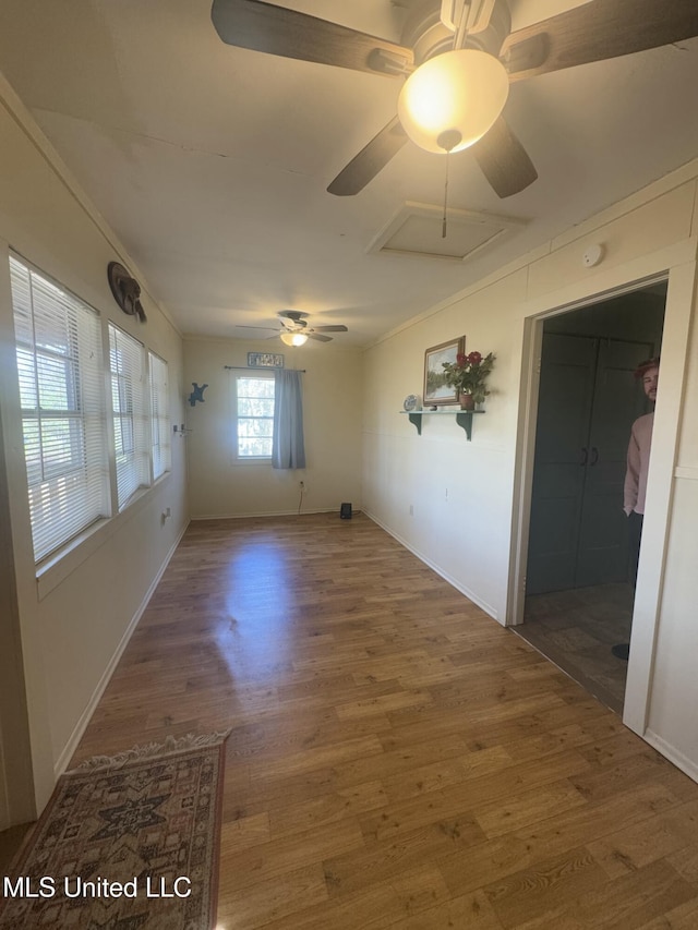 spare room with crown molding and wood-type flooring