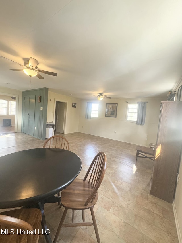 dining room featuring ceiling fan