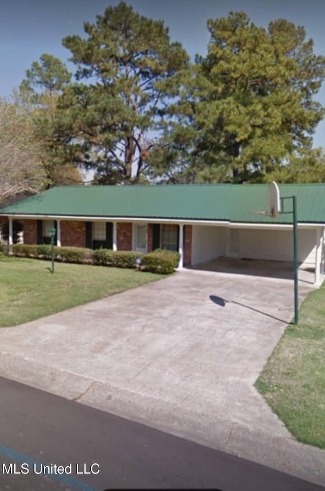 305 John Glenn Ave, Natchez, MS 39120 - ranch-style home with concrete driveway, a front yard, and an attached carport