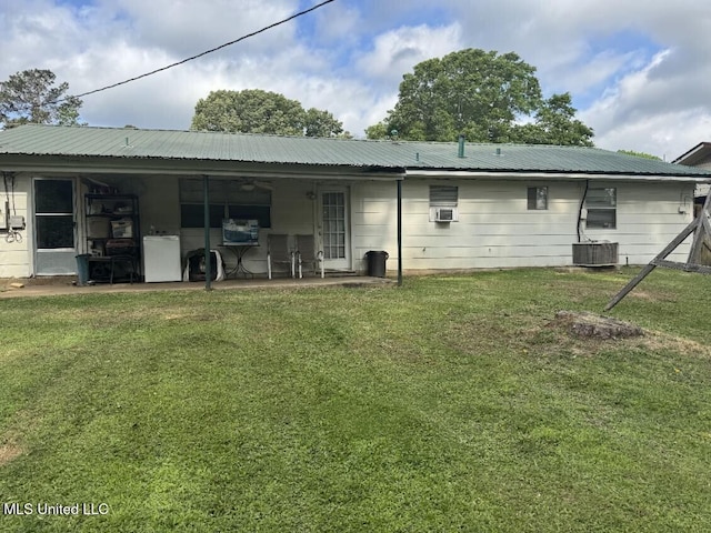 305 John Glenn Ave, Natchez, MS 39120 - rear view of house with a lawn, a patio area, metal roof, and central air condition unit