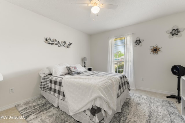 bedroom featuring baseboards and a ceiling fan