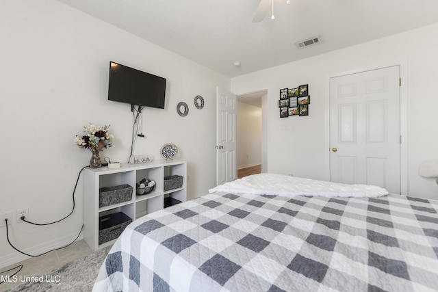 bedroom with light tile patterned floors, a ceiling fan, and visible vents