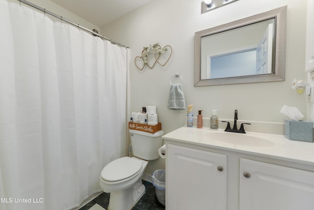 bathroom with toilet and vanity