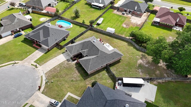 birds eye view of property with a residential view