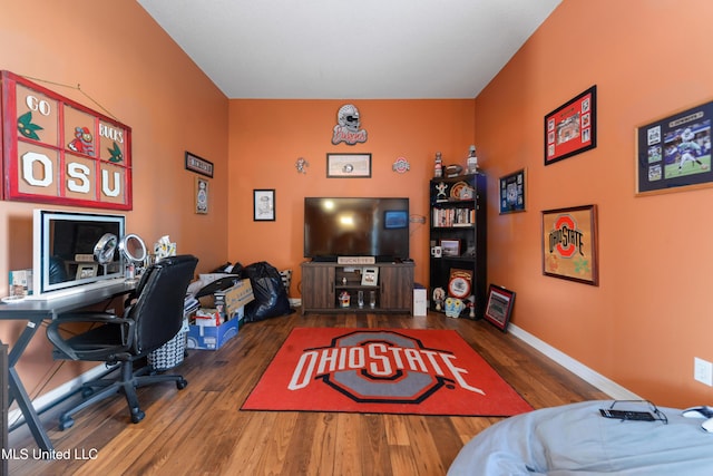 office featuring baseboards and wood finished floors