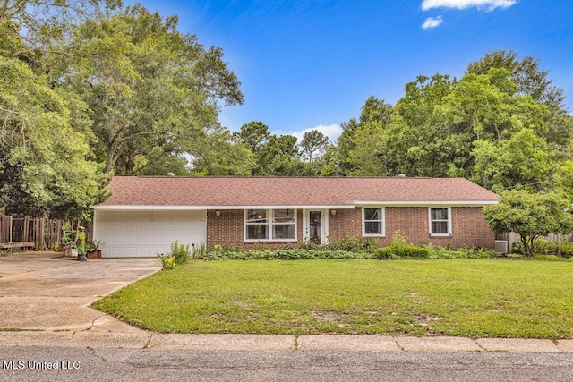 931 Brown St, Gulfport, MS 39507 - view of front of property featuring a garage, concrete driveway, and brick siding