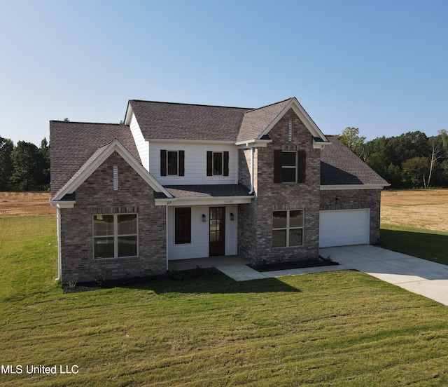 390 Centerline Roper Loop, Byhalia, MS 38611 - view of front of property with concrete driveway, a front lawn, a shingled roof, brick siding, and a garage