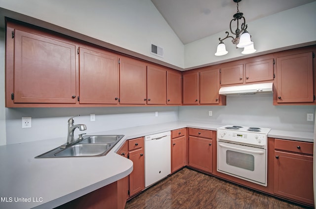 kitchen featuring white appliances, sink, dark hardwood / wood-style flooring, vaulted ceiling, and pendant lighting