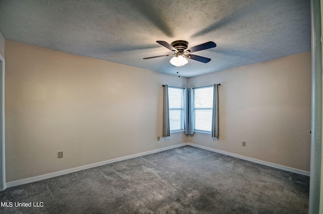 carpeted empty room with ceiling fan and a textured ceiling