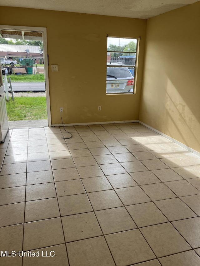 1710 Eastward Dr, Gulfport, MS 39501 - spare room with light tile patterned floors and baseboards