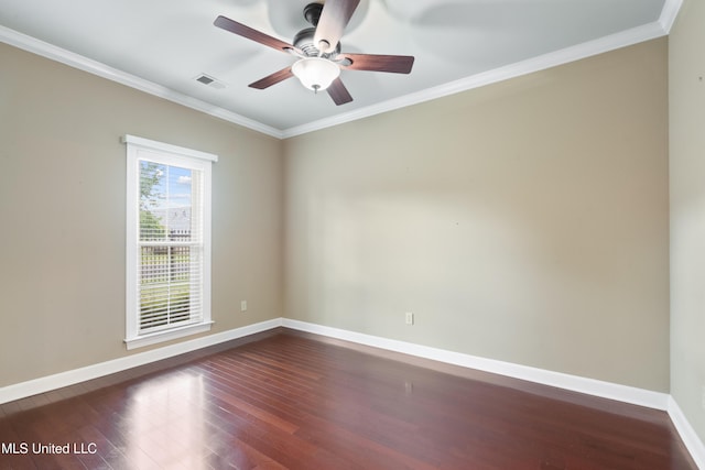spare room featuring baseboards, dark wood-type flooring, crown molding, and ceiling fan