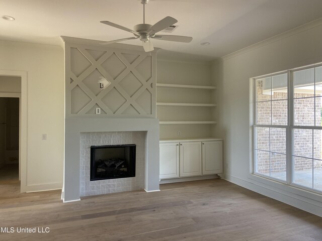 422 Baleigh Way, Canton, MS 39046 - unfurnished living room with ceiling fan, light wood-type flooring, baseboards, a tile fireplace, and recessed lighting