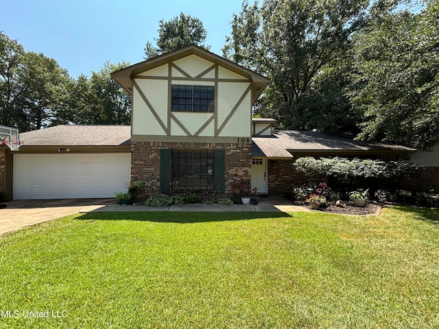 tudor house with a front yard and a garage