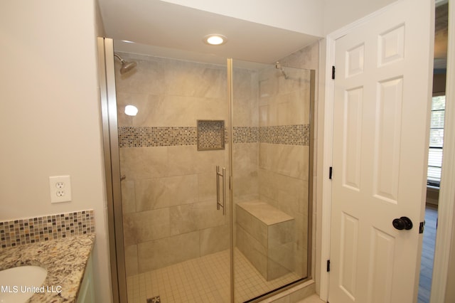 bathroom featuring vanity and walk in shower