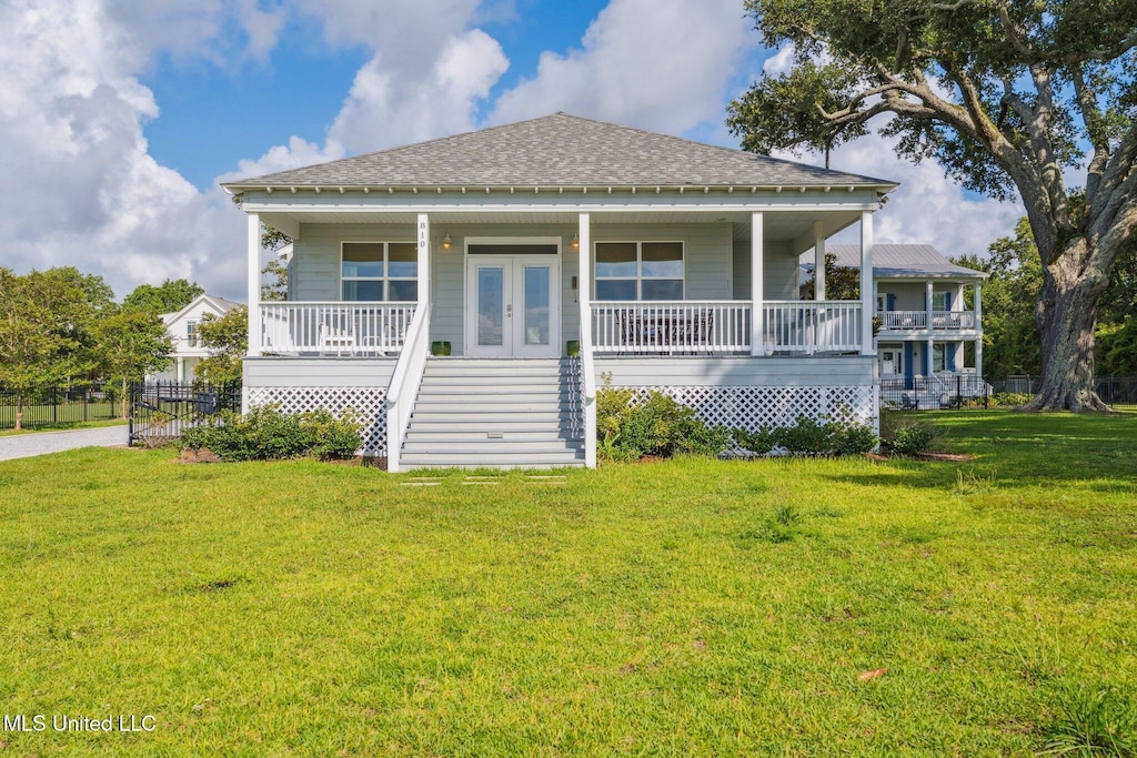 810 S Beach Blvd, Bay Saint Louis, MS 39520 - view of front of house featuring covered porch, stairs, and a shingled roof