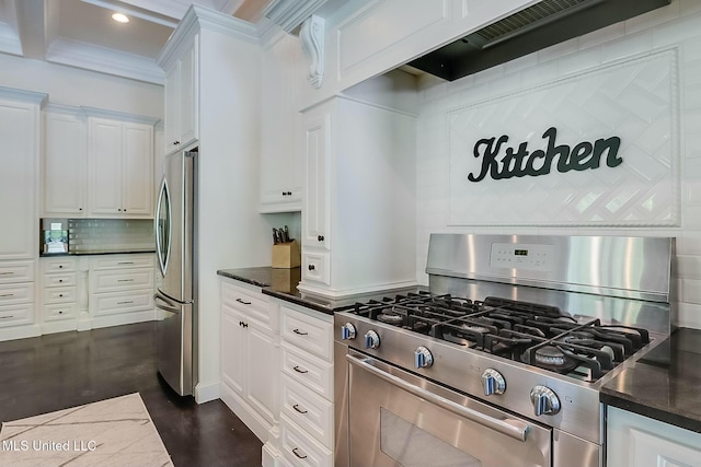 8521 Julia Dr, Vancleave, MS 39565 - kitchen with white cabinets, recessed lighting, decorative backsplash, appliances with stainless steel finishes, and custom exhaust hood