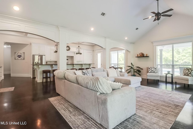 8521 Julia Dr, Vancleave, MS 39565 - living area featuring recessed lighting, visible vents, a ceiling fan, arched walkways, and high vaulted ceiling