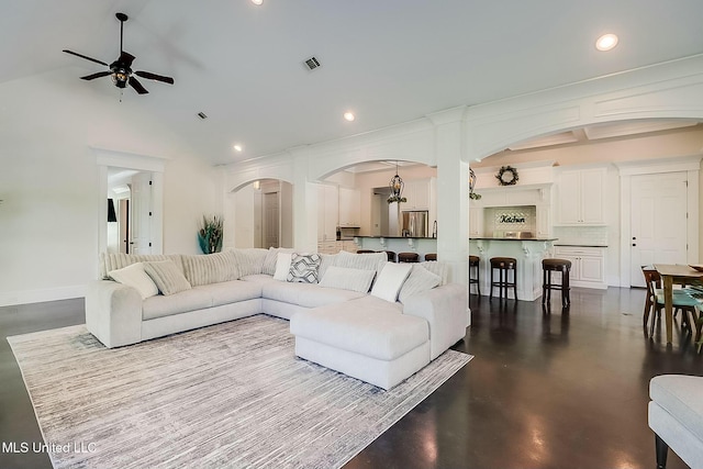 8521 Julia Dr, Vancleave, MS 39565 - living room with arched walkways, finished concrete floors, ceiling fan, and recessed lighting