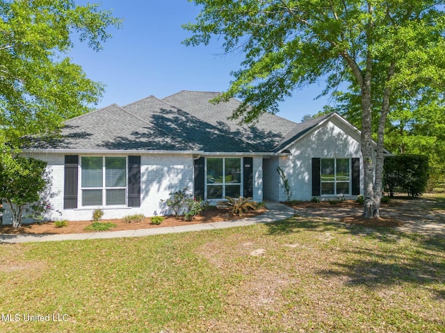 8521 Julia Dr, Vancleave, MS 39565 - single story home featuring a front lawn, brick siding, and roof with shingles