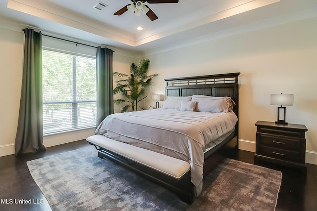 8521 Julia Dr, Vancleave, MS 39565 - bedroom with concrete flooring, a tray ceiling, baseboards, ornamental molding, and visible vents