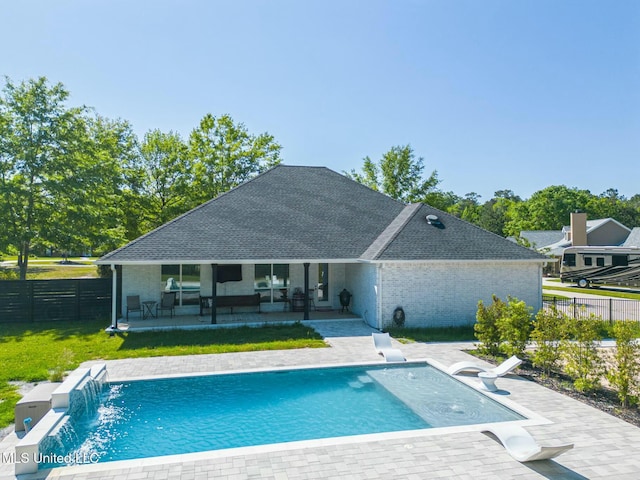 8521 Julia Dr, Vancleave, MS 39565 - rear view of house with a yard, a fenced in pool, a fenced backyard, and a patio