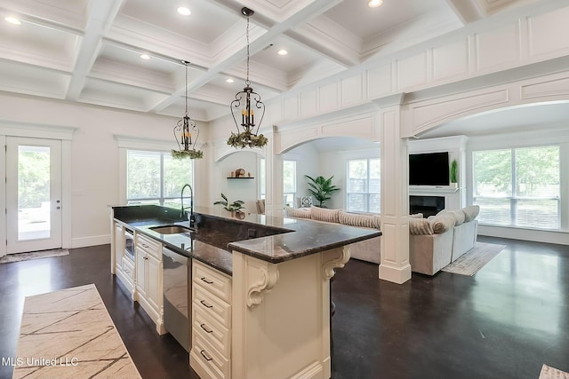 8521 Julia Dr, Vancleave, MS 39565 - kitchen featuring coffered ceiling, a sink, arched walkways, appliances with stainless steel finishes, and open floor plan