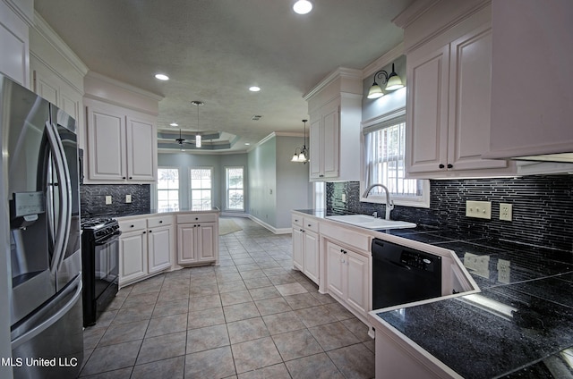 kitchen with white cabinetry, black appliances, sink, and decorative light fixtures