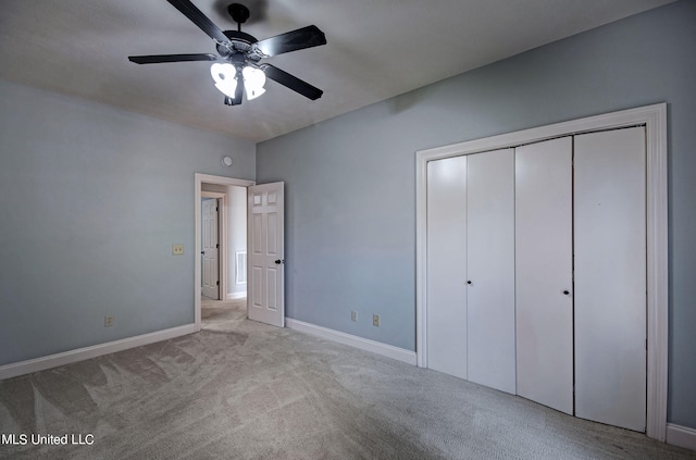 unfurnished bedroom featuring a closet, ceiling fan, and light carpet