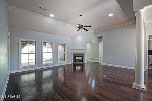 unfurnished living room with dark hardwood / wood-style floors, ornamental molding, decorative columns, high vaulted ceiling, and ceiling fan